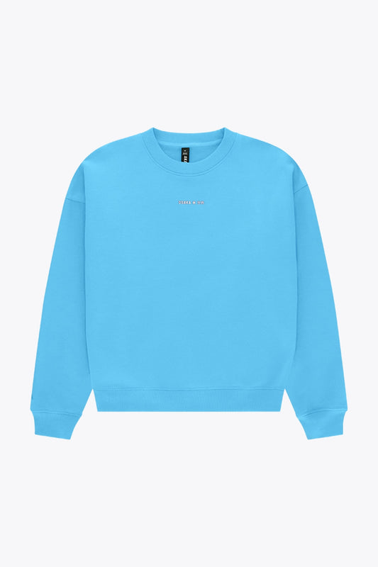 Osaka women sweater in light blue with logo in white. Front flatlay view