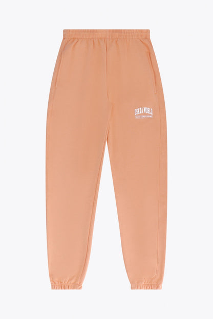 Osaka women sweatpants in peach with logo in white. Front flatlay view