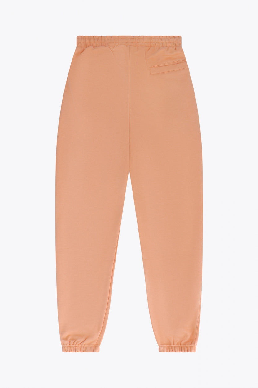 Osaka women sweatpants in peach with logo in white. Back flatlay view