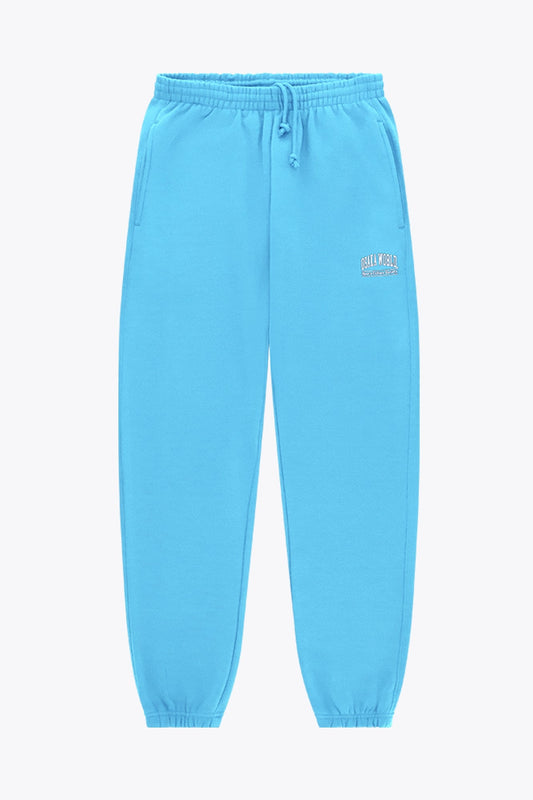 Osaka women sweatpants in light blue with logo in white. Front flatlay view