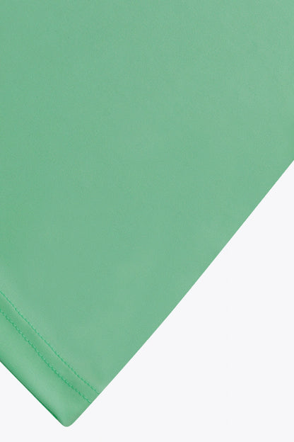 Osaka women tee short sleeve in green with logo in grey. Detail fabric view