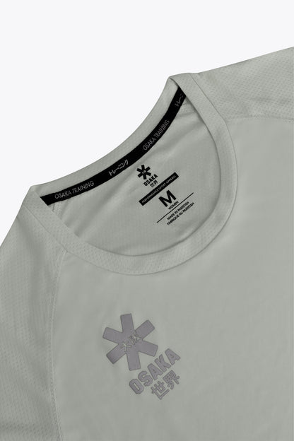 Osaka women tee short sleeve in light grey with logo in grey. Front flatlay detail view