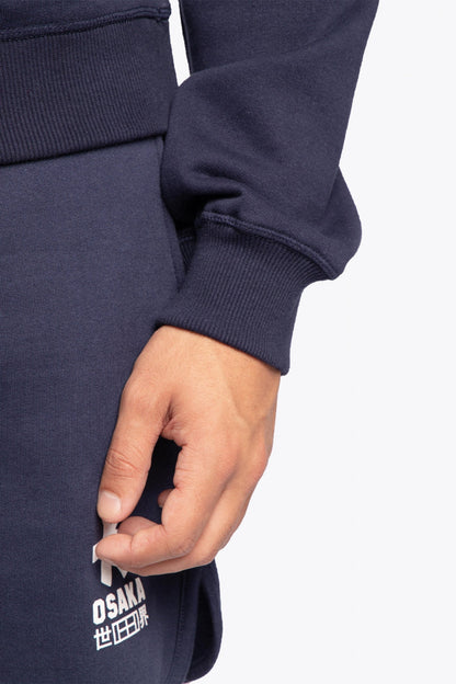 The Osaka navy basic unisex sweater with logo in white. Front detail sleeve view