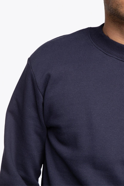 The Osaka navy basic unisex sweater with logo in white. Front detail shoulder view