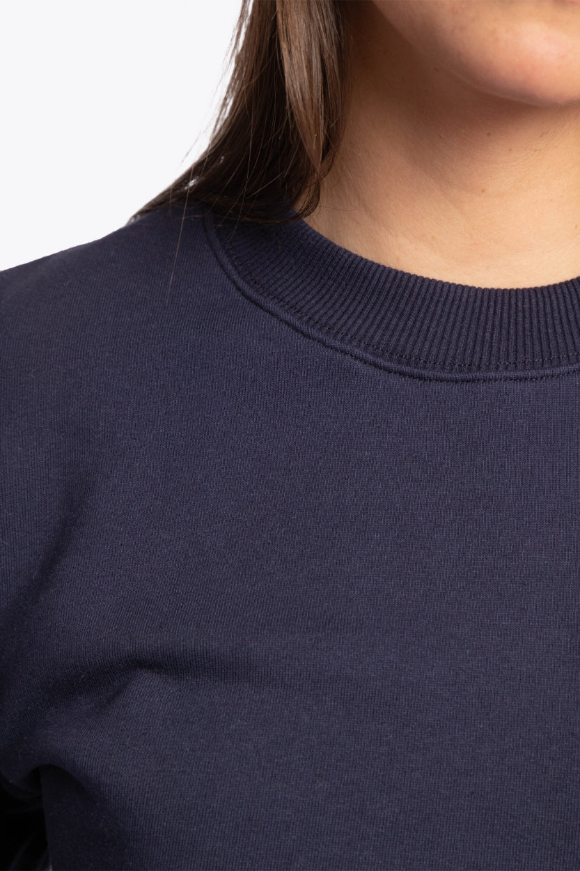 The Osaka navy basic unisex sweater with logo in white. Front detail neck view