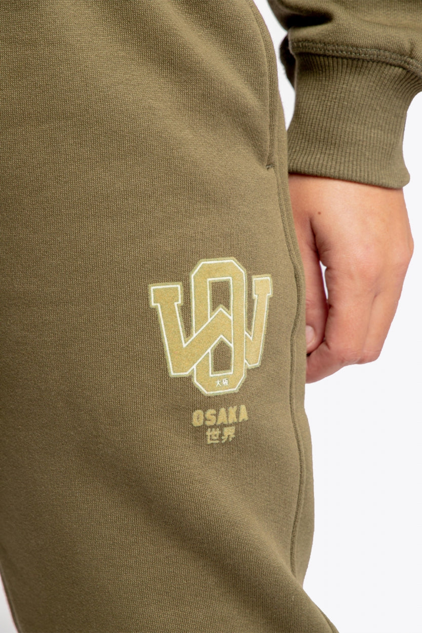 Osaka unisex sweatpants in army green with logo in yellow.  Detail logo view
