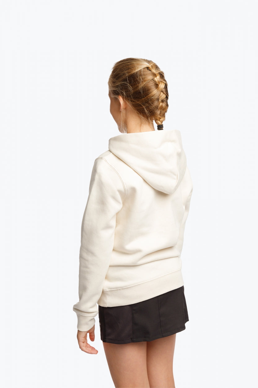 Girl wearing the Osaka kids hoodie in natural raw with college letters in orange and logo in blue. Back view