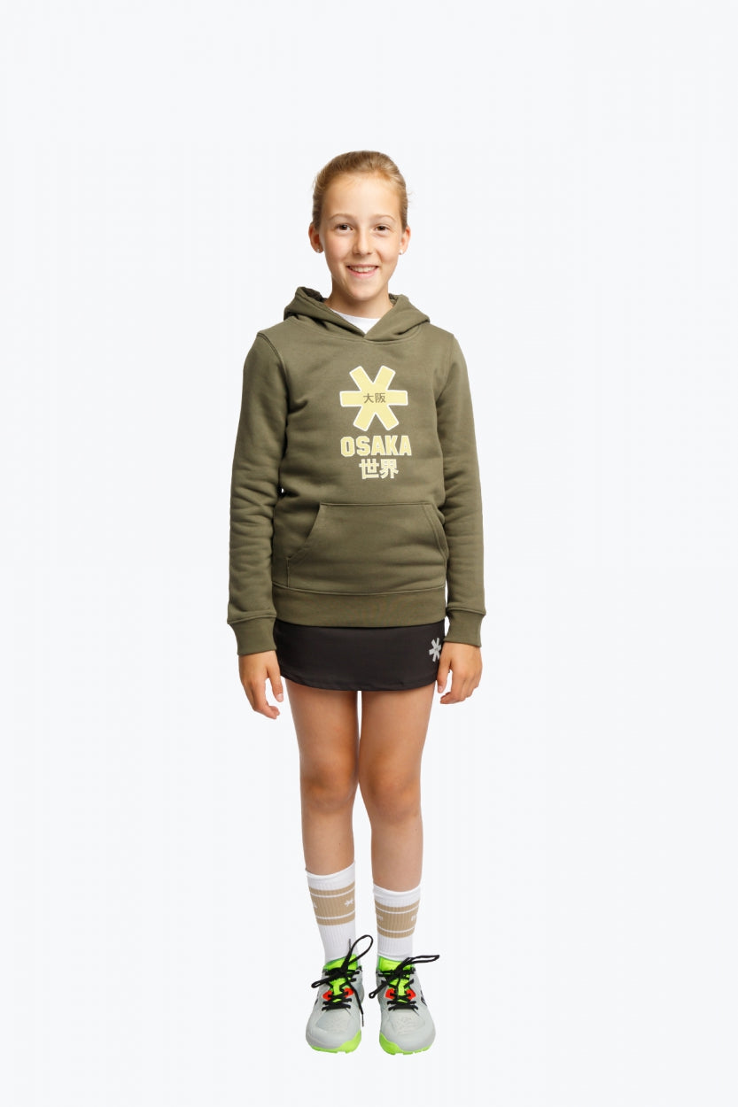 Girl wearing the Osaka kids hoodie in khaki with yellow logo. Full front view