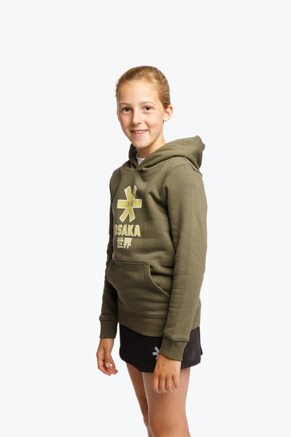 Girl wearing the Osaka kids hoodie in khaki with yellow logo. Side/front view