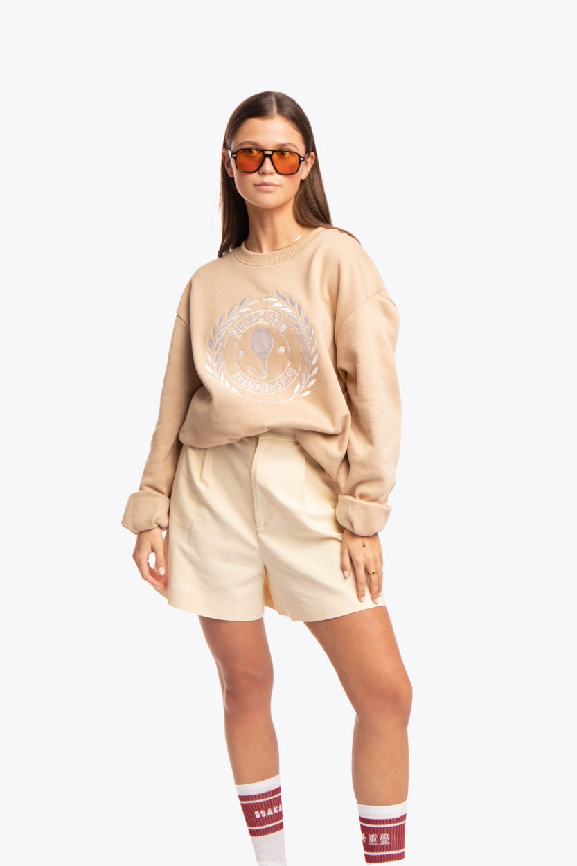 Woman wearing the Osaka x Buenas Open sweater in stone. Front view