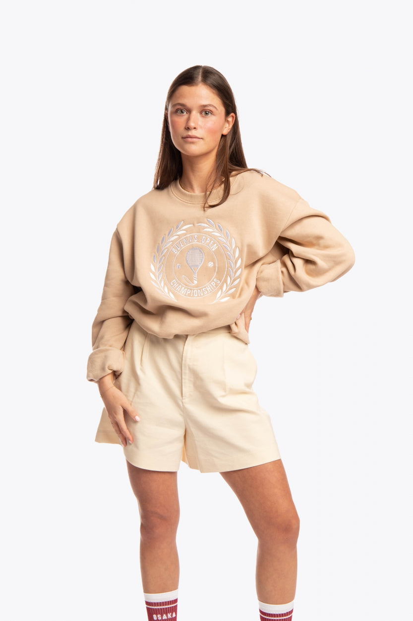 Woman wearing the Osaka x Buenas Open sweater in stone. Front view