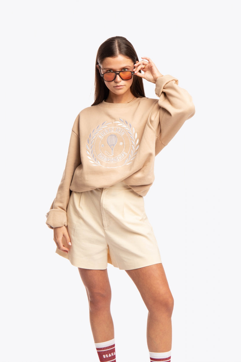 Woman wearing the Osaka x Buenas Open sweater in stone. Front view