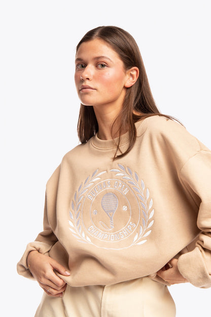 Woman wearing the Osaka x Buenas Open sweater in stone. Front view