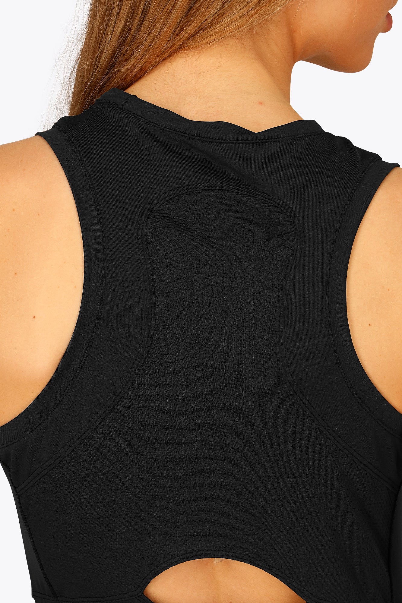 Woman wearing the Osaka women floucy dress black. Back detail view