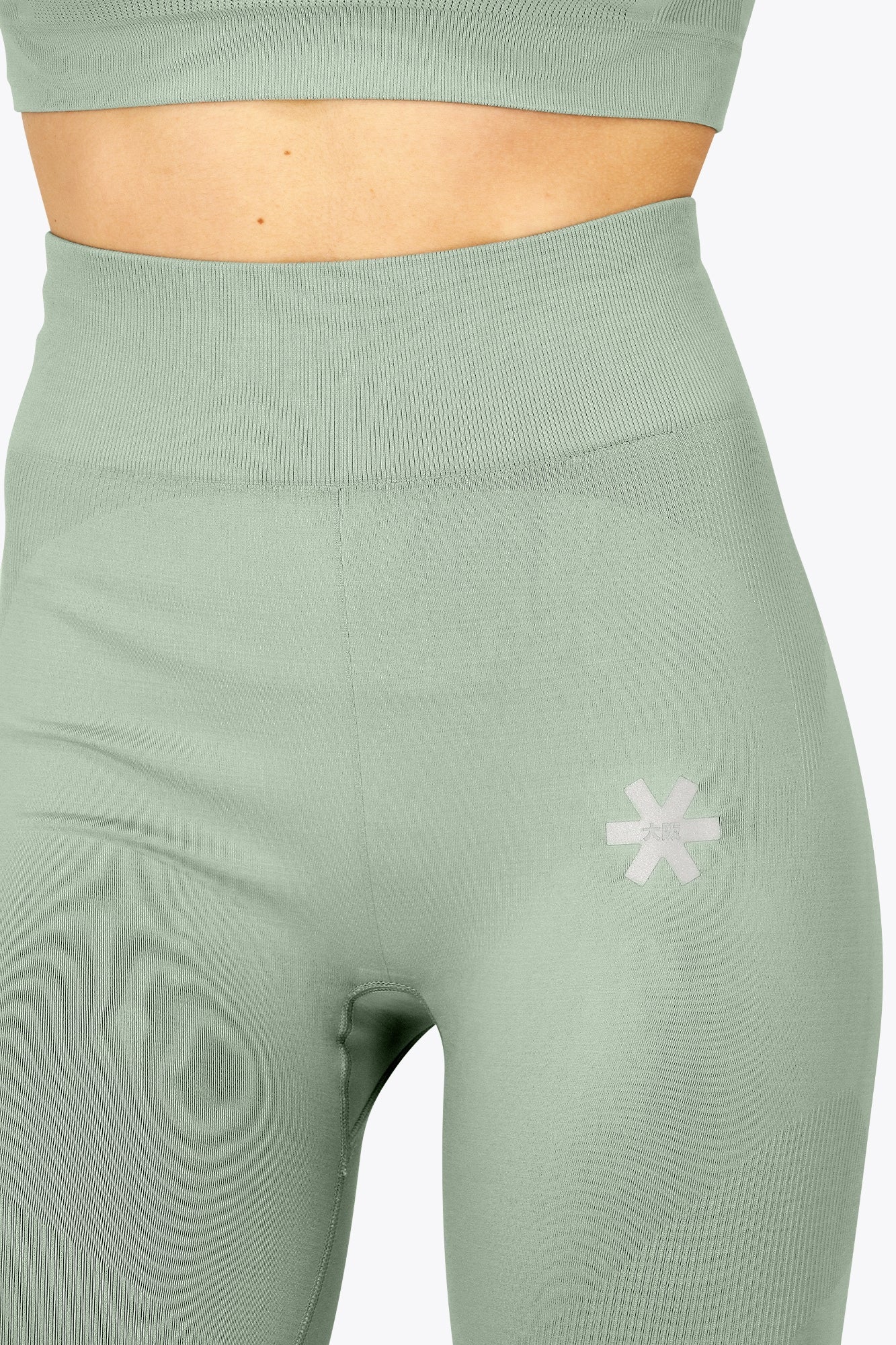 Osaka women shimuresu leggin in jadeite with logo in grey. Front detail logo view