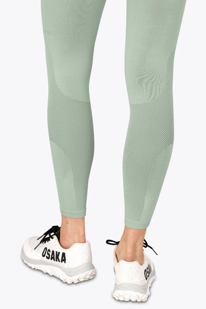 Osaka women shimuresu leggin in jadeite with logo in grey. Back detail bottom mesh view