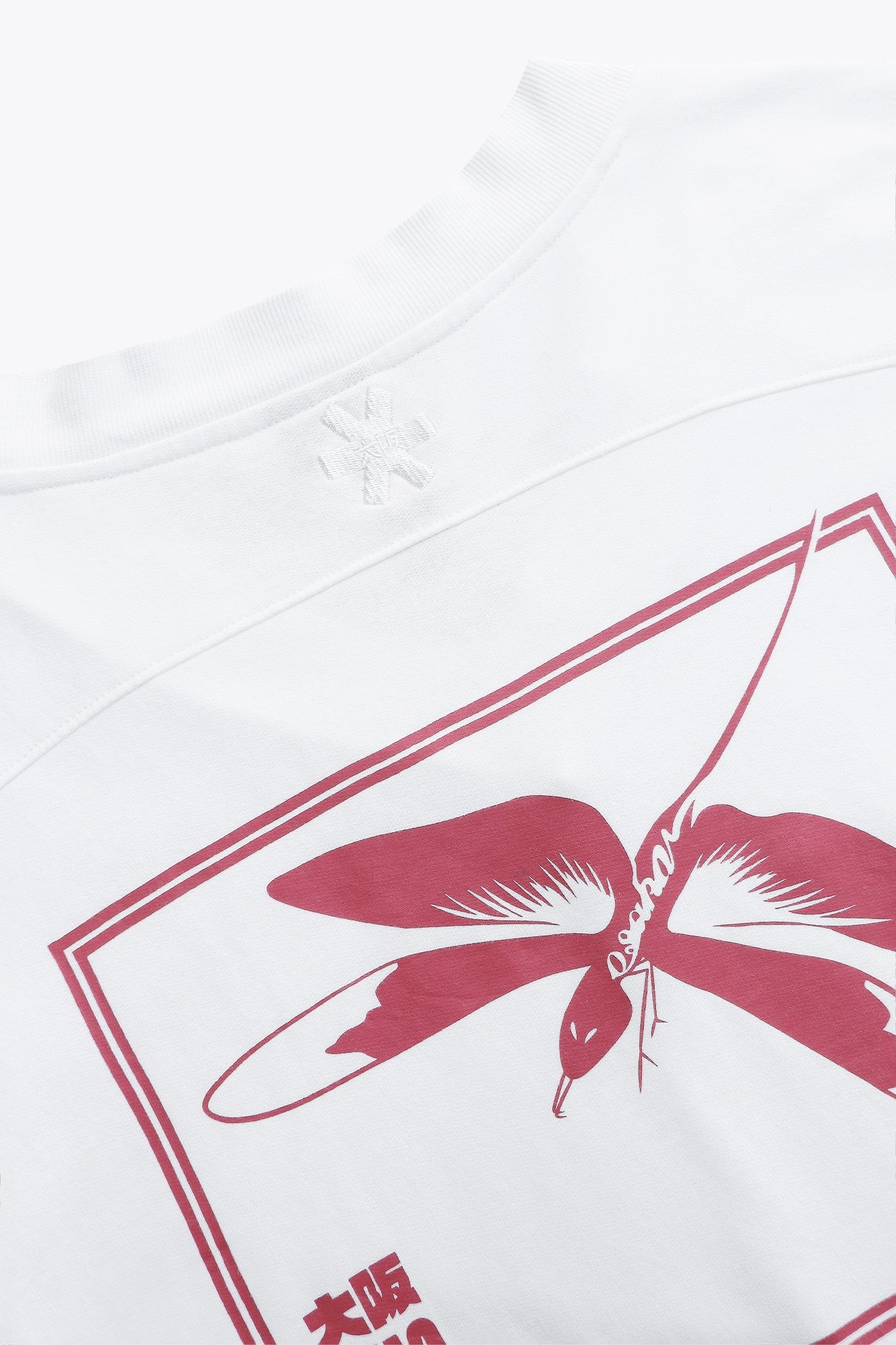 Osaka women v-neck cropped sweater white with logo in red. Back flatlay detail logo view