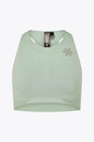 Osaka women tech sports bra in jadeite with logo in grey. Front flatlay view