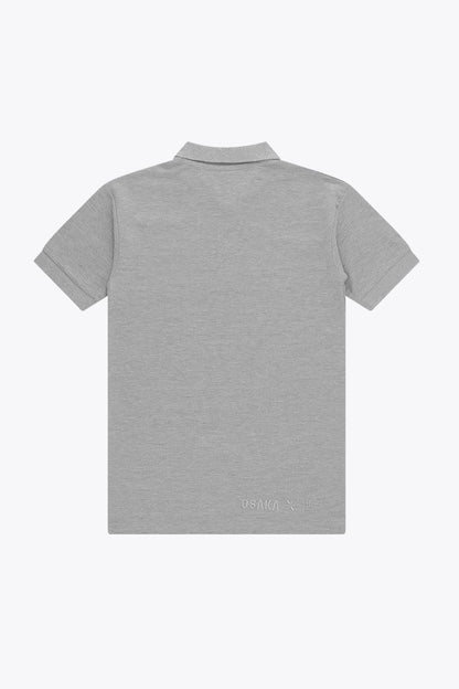 Osaka unisex basic polo in grey with grey logo. Back flatlay view