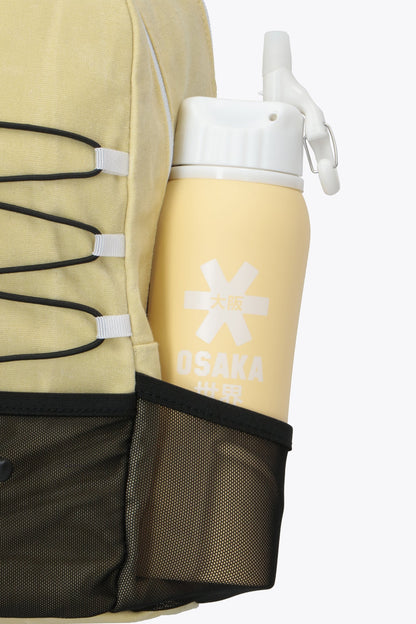 Osaka pro tour backpack in faded yellow with logo in white. Detail bottle holder view