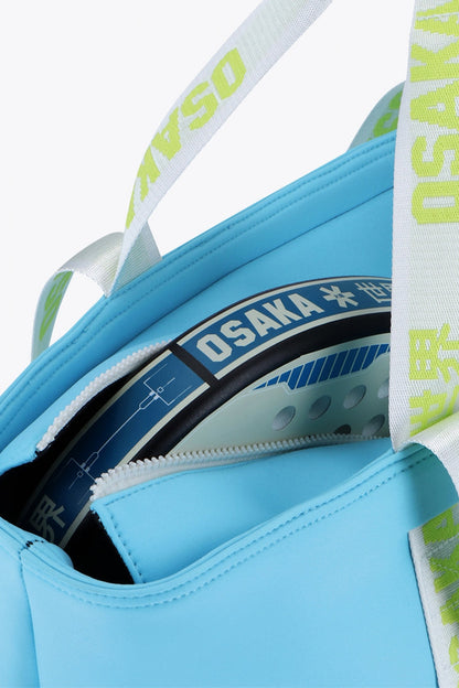 Osaka neoprene Tote bag in light blue with logo in white. Detail zip view