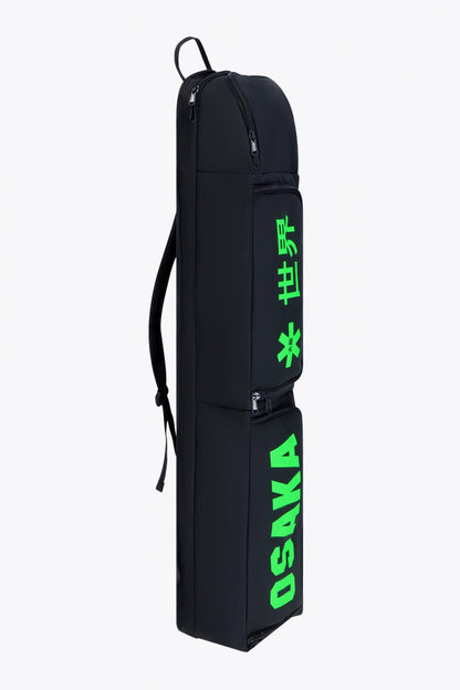 Osaka sports stickbag medium in black with logo in green. Side view
