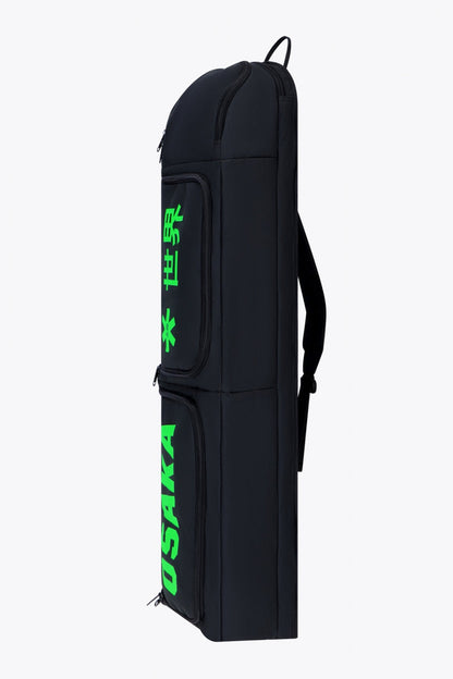 Osaka sports stickbag medium in black with logo in green. Side view