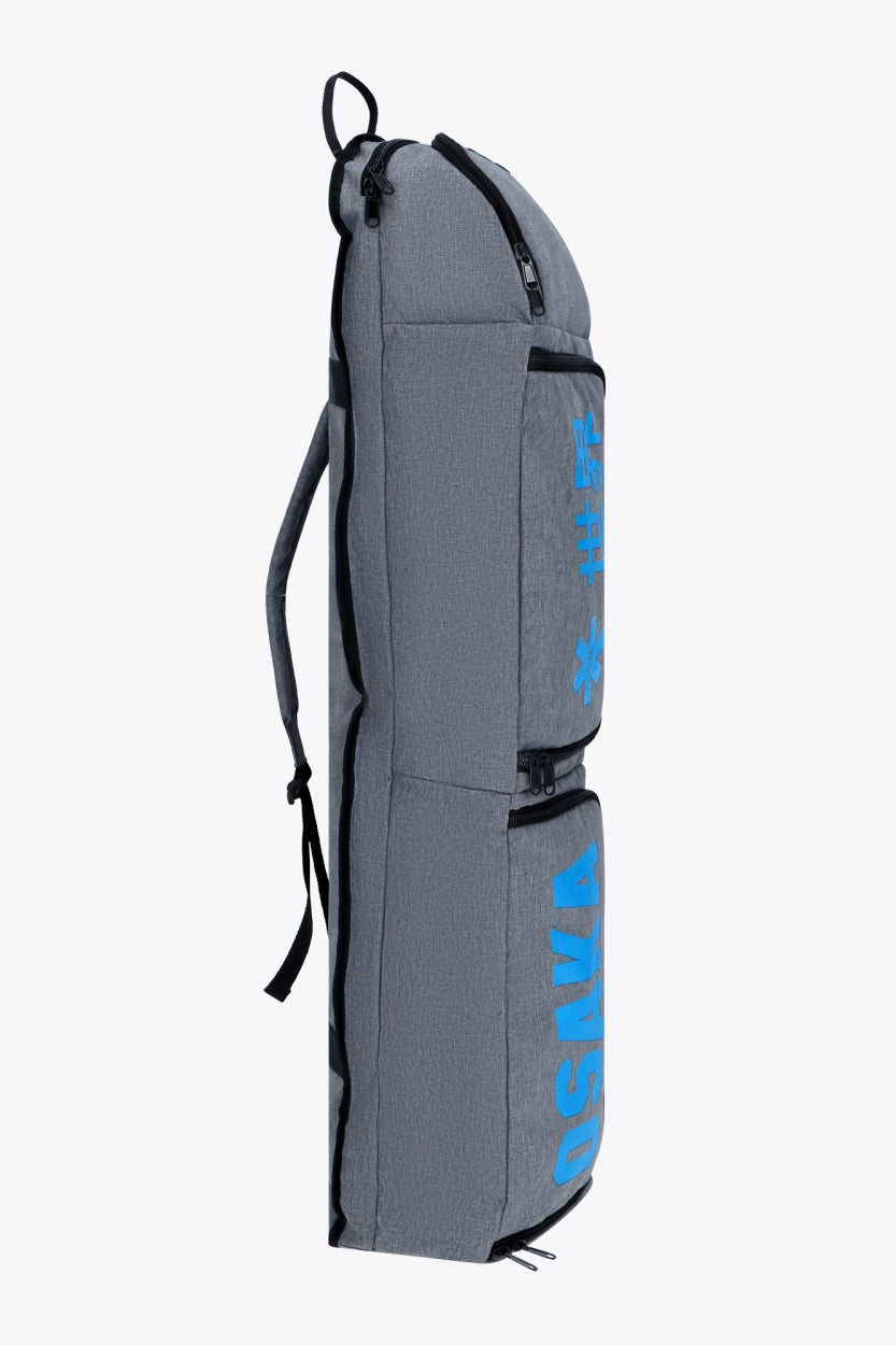 Osaka sports stickbag medium in light grey with logo in blue. Side view