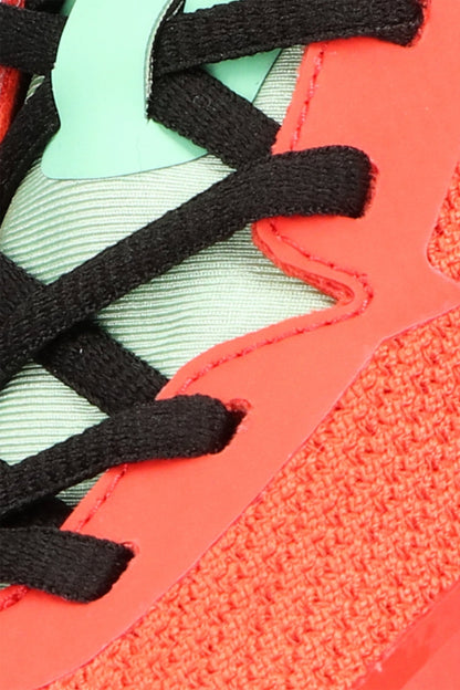 Osaka footwear Kai Mk1 in oxy fire and cream jade with logo in green. Detail shoelace view