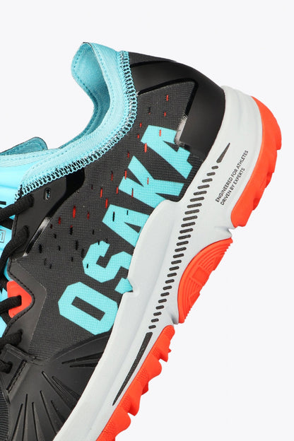 Osaka footwear Ido Mk1 in black and aqua blue with logo in aqua blue. Detail logo view
