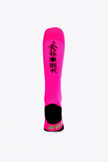 Osaka Field Hockey Socks in pink with Osaka logo in green. Back view