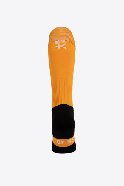 Osaka Field Hockey Socks in mellow yellow with Osaka logo in green. Back view