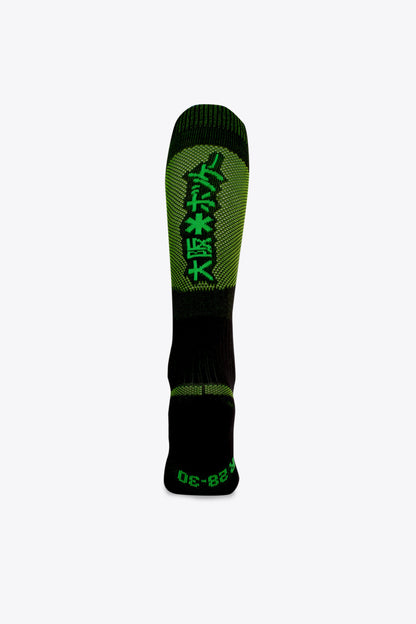 Osaka Field Hockey Socks black-yellow melange with Osaka logo in green. Back view