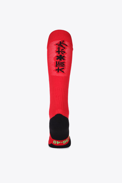 Osaka Field Hockey Socks in red with Osaka logo in green. Back view