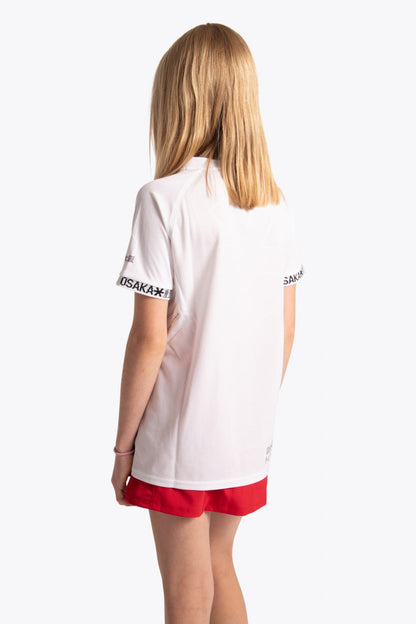 Girl wearing the Osaka Kids Jersey in white. Back view