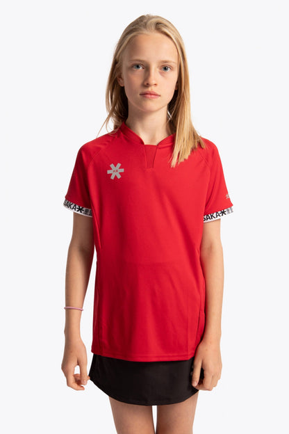 Girl wearing the Osaka Kids Jersey in Red. Front view