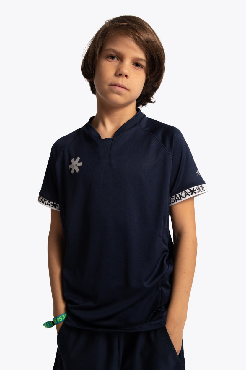 Boy wearing the Osaka Kids Jersey in Navy. Front view