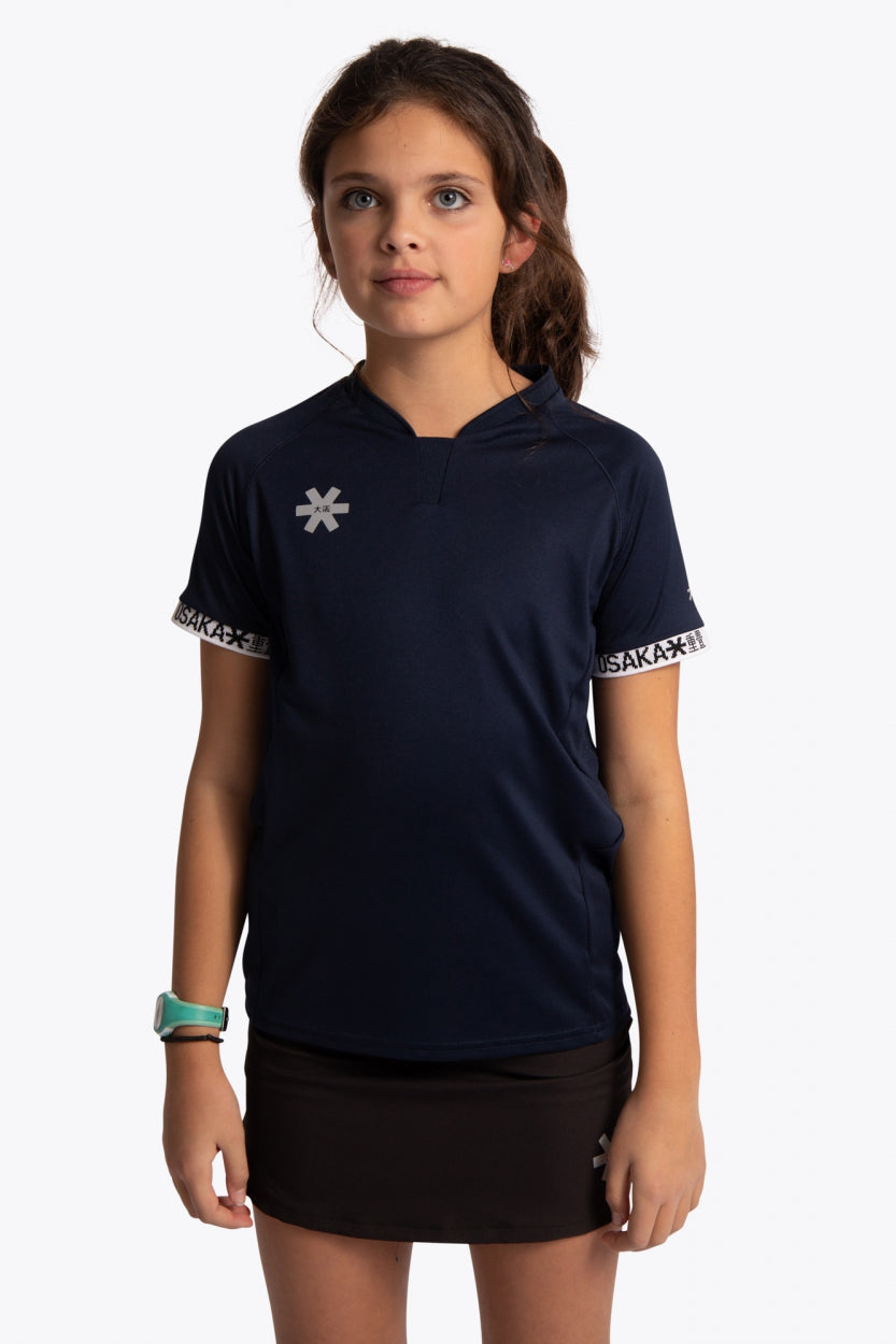 Girl wearing the Osaka Kids Jersey in Navy. Front view