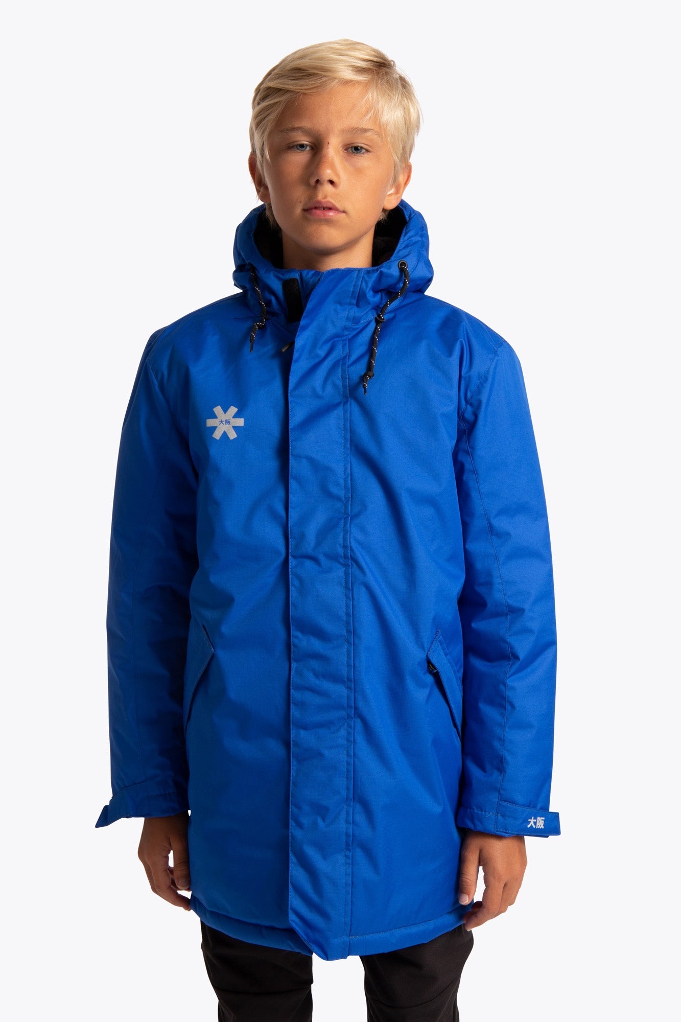 Boy wearing the Osaka Kids Stadium Jacket in Navy Blue. Front view