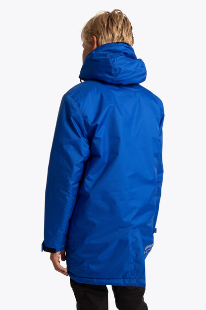 Boy wearing the Osaka Kids Stadium Jacket in Navy Blue. Back view