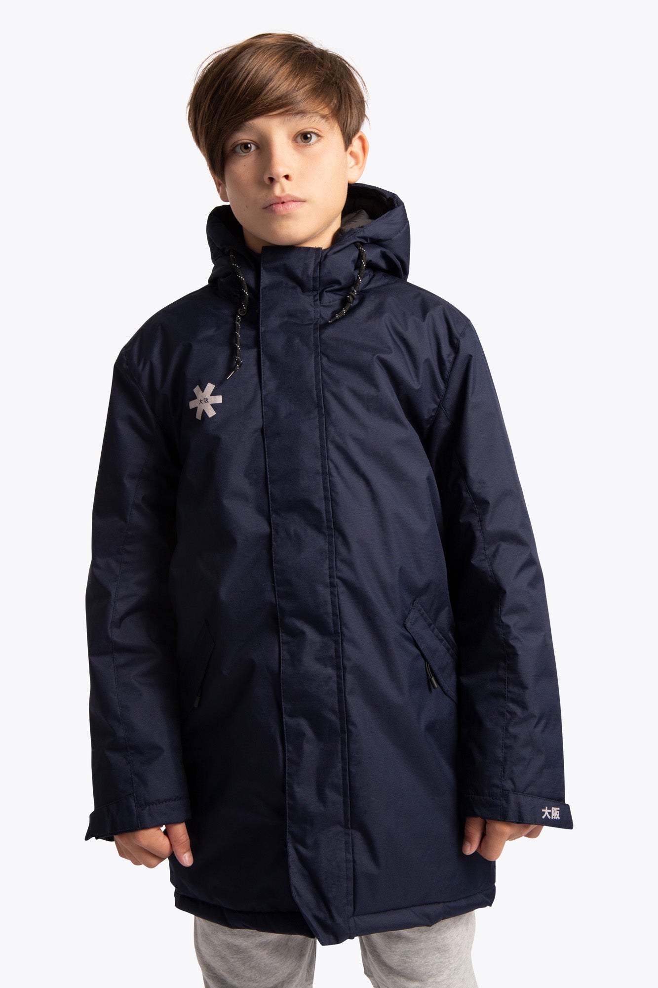 Boy wearing the Osaka Kids Stadium Jacket in Navy. Front view
