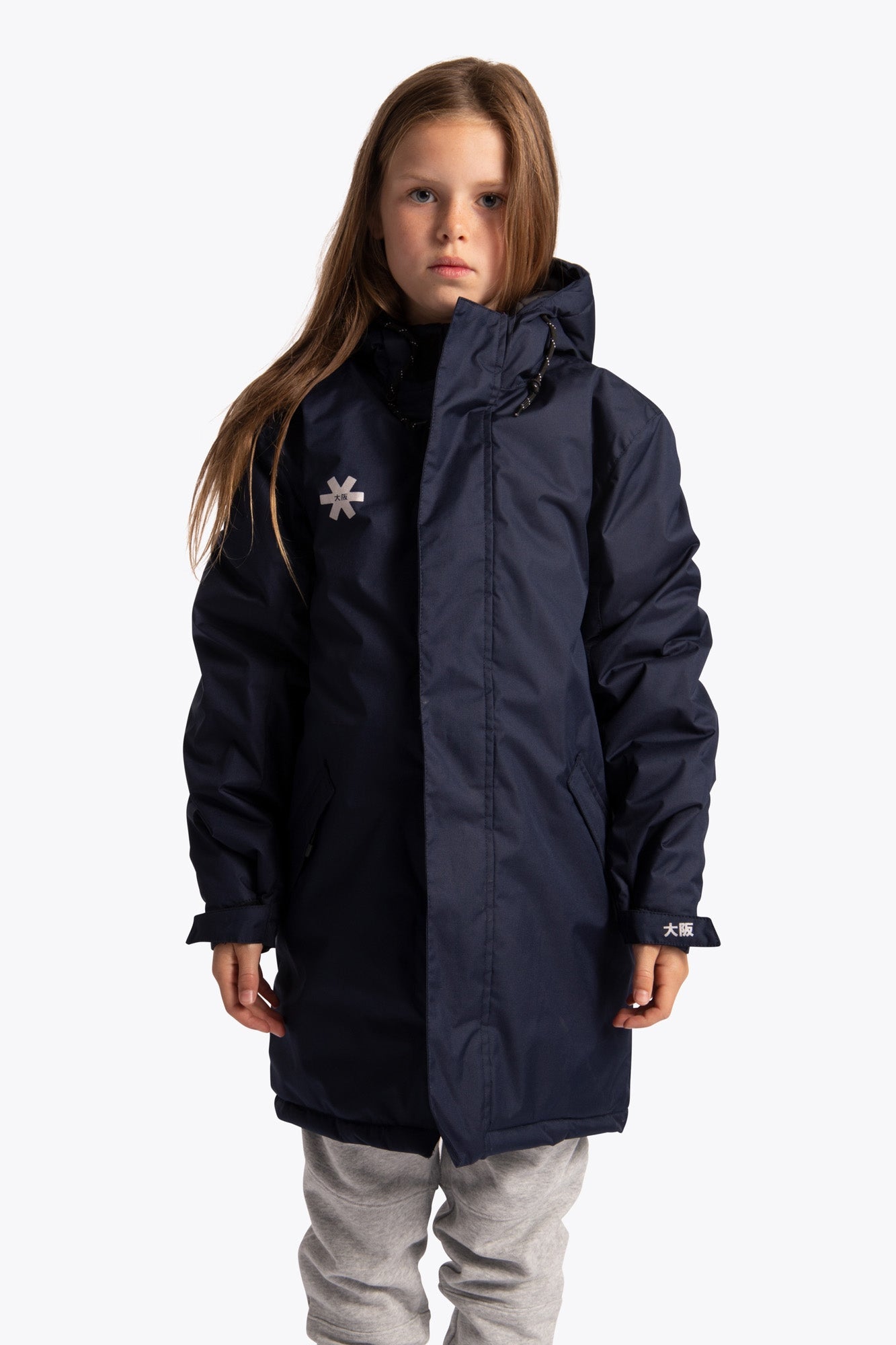 Girl wearing the Osaka Kids Stadium Jacket in Navy. Front view