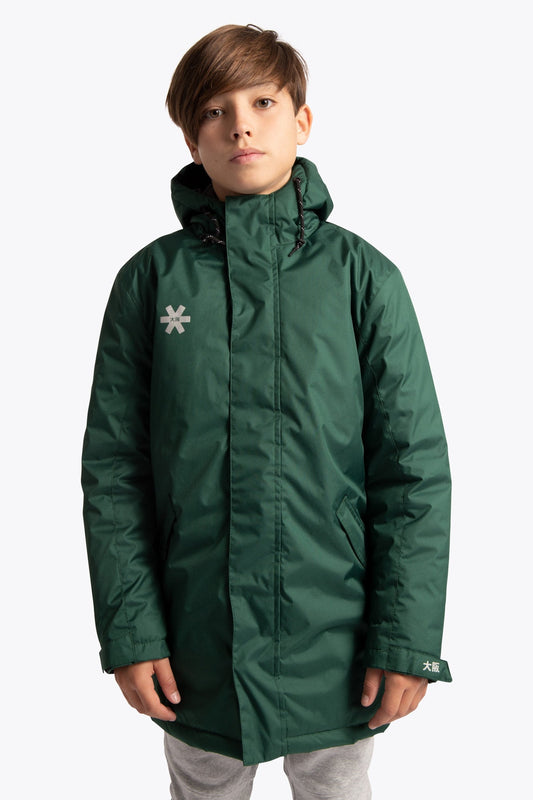 Boy wearing the Osaka Kids Stadium Jacket in Dark Green. Front view