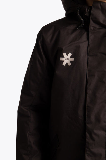Osaka Kids Stadium Jacket in Black. Front detail logo view
