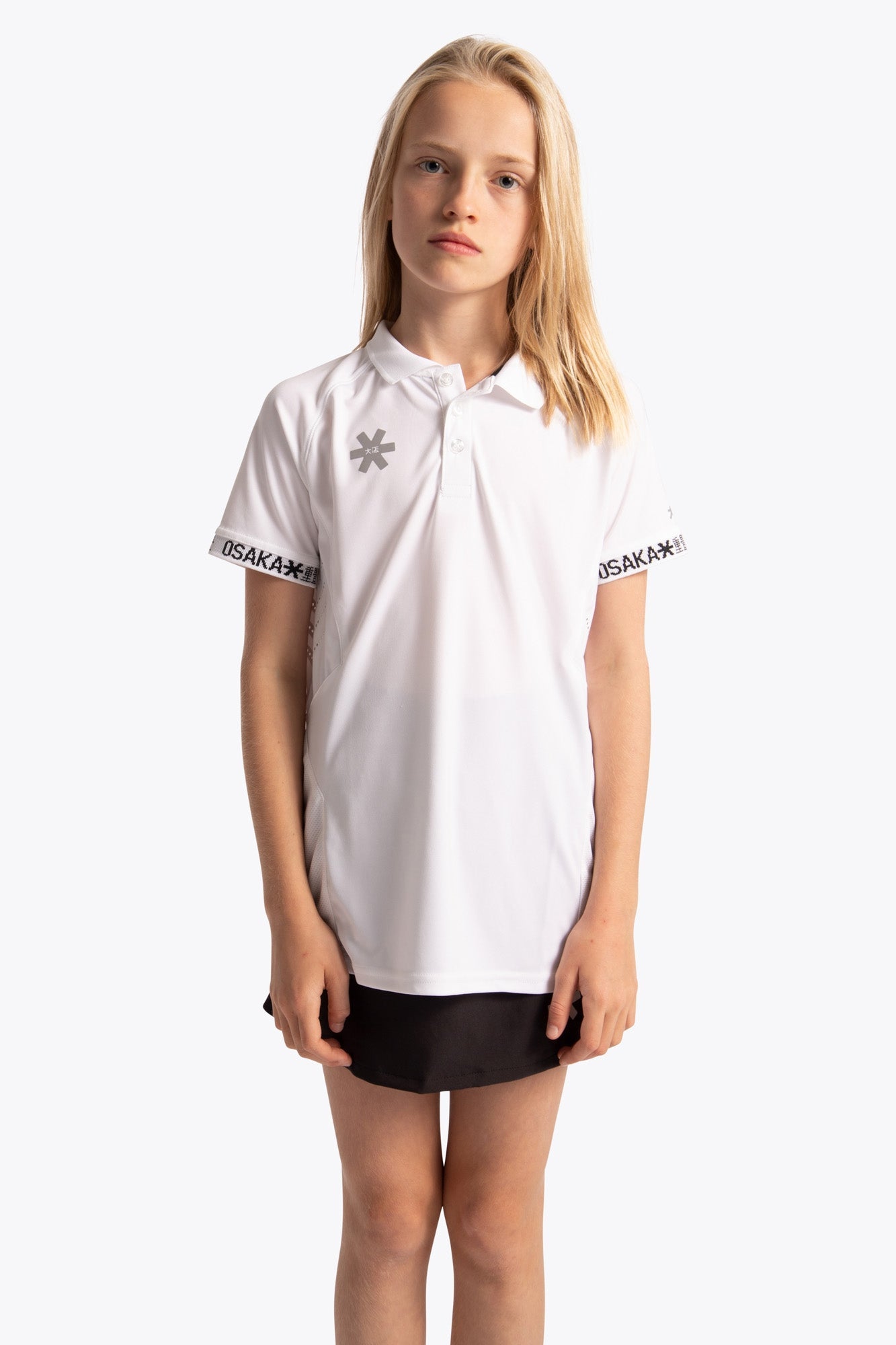 Girl wearing the Osaka Kids Polo Jersey in White. Front view