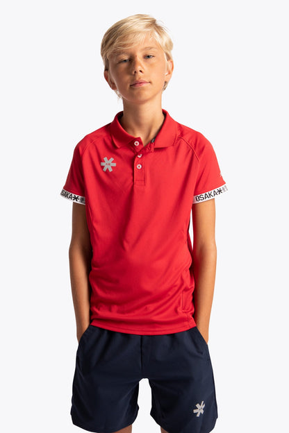 Boy wearing the Osaka Kids Polo Jersey in Red. Front view