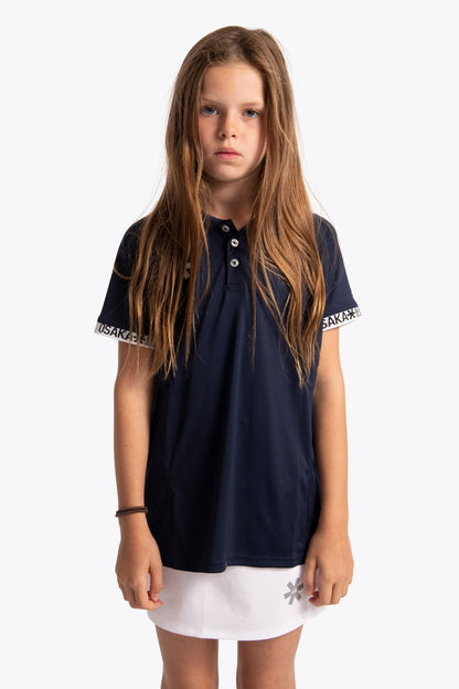 Girl wearing the Osaka Kids Polo Jersey in Navy. Front view