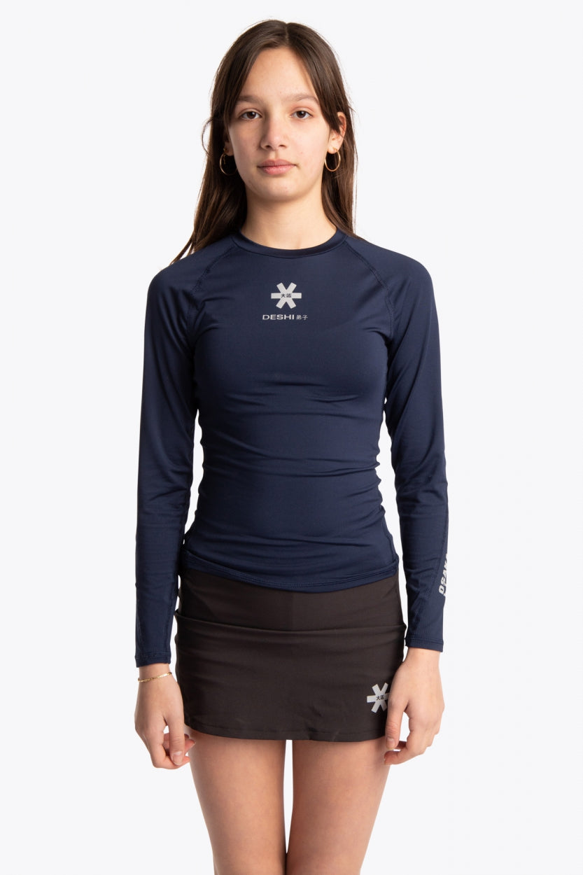  Girl wearing the Osaka Kids Baselayer Top in Navy. Front view
